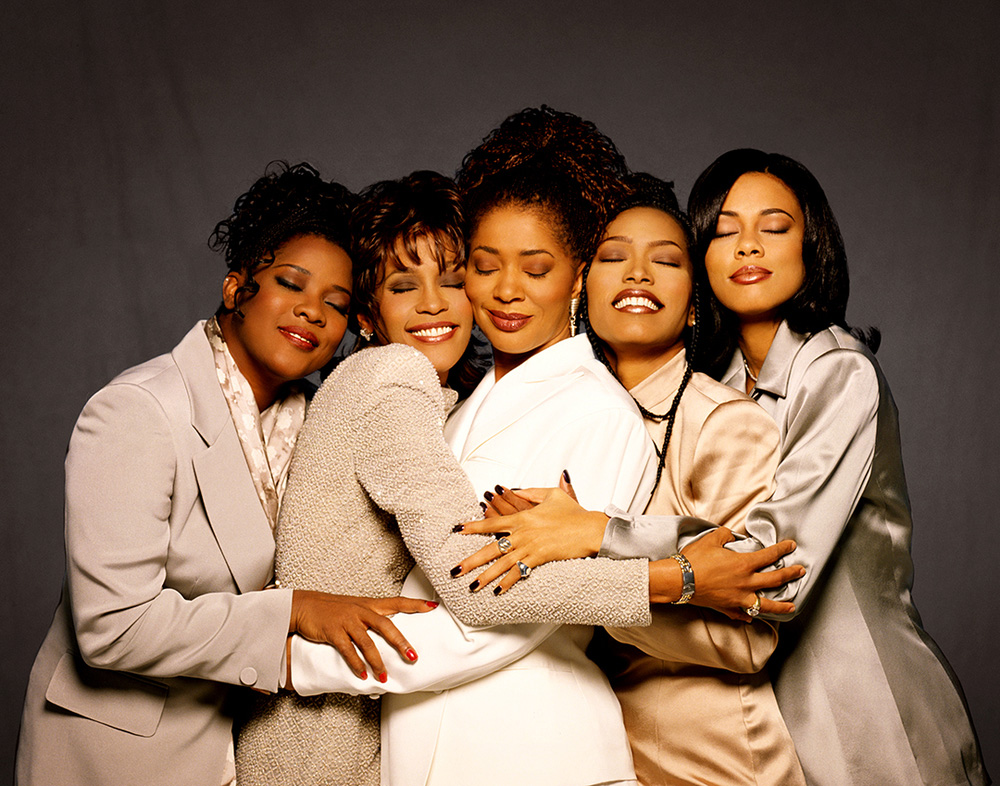 Waiting to Exhale photoshoot featuring the legendary cast—Whitney Houston, Angela Bassett, Loretta Devine, and Lela Rochon—alongside the book’s author, Terry McMillan. Photography by Matthew Jordan Smith